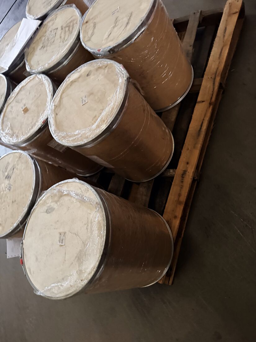 Fibre drums on a wooden pallet in a warehouse